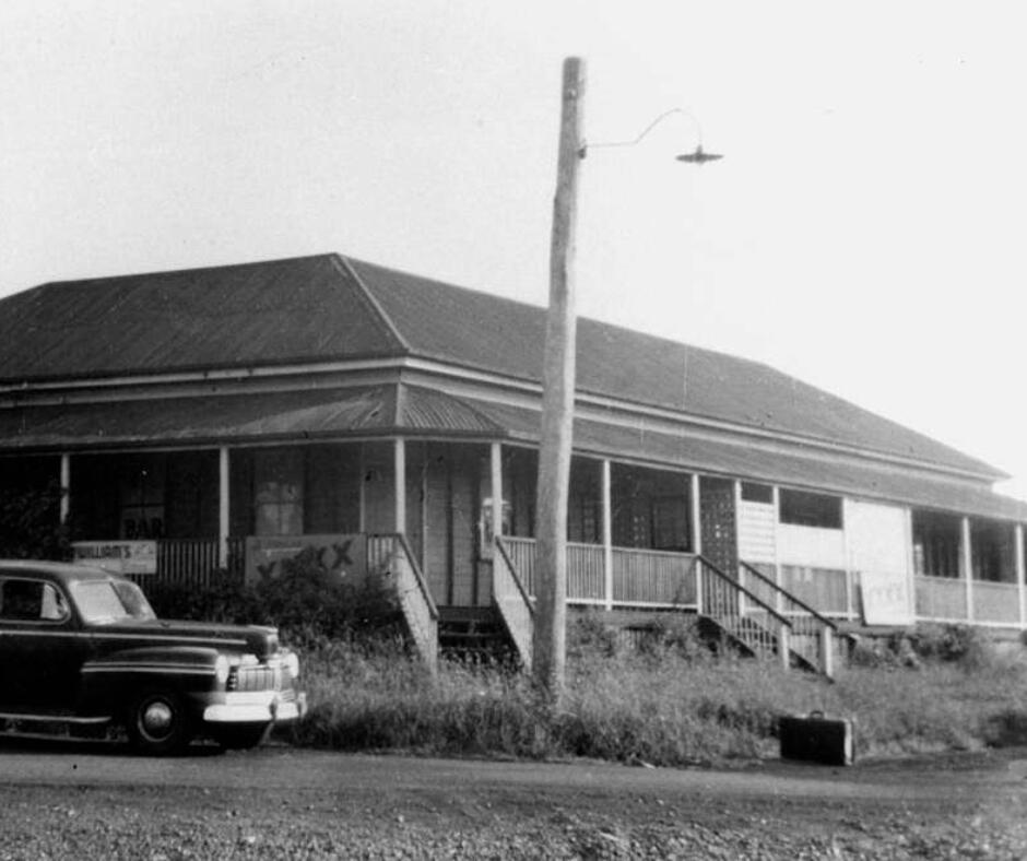 A historic shot of the Tingoora Hotel - it is in black and white with an old station wagon parked out the front. Circa 1960's.